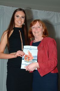 Judy Greene presents Catherine with the Basketball award